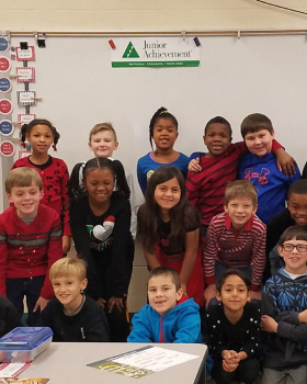 Katherine James of the Lexington office with her 3rd grade Junior Achievement class