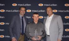 Group photo including (left to right) Mike Sausman, Jeremy Conn, and Bill Wilkins with Jeremy holdig his engraved crystal leadership award